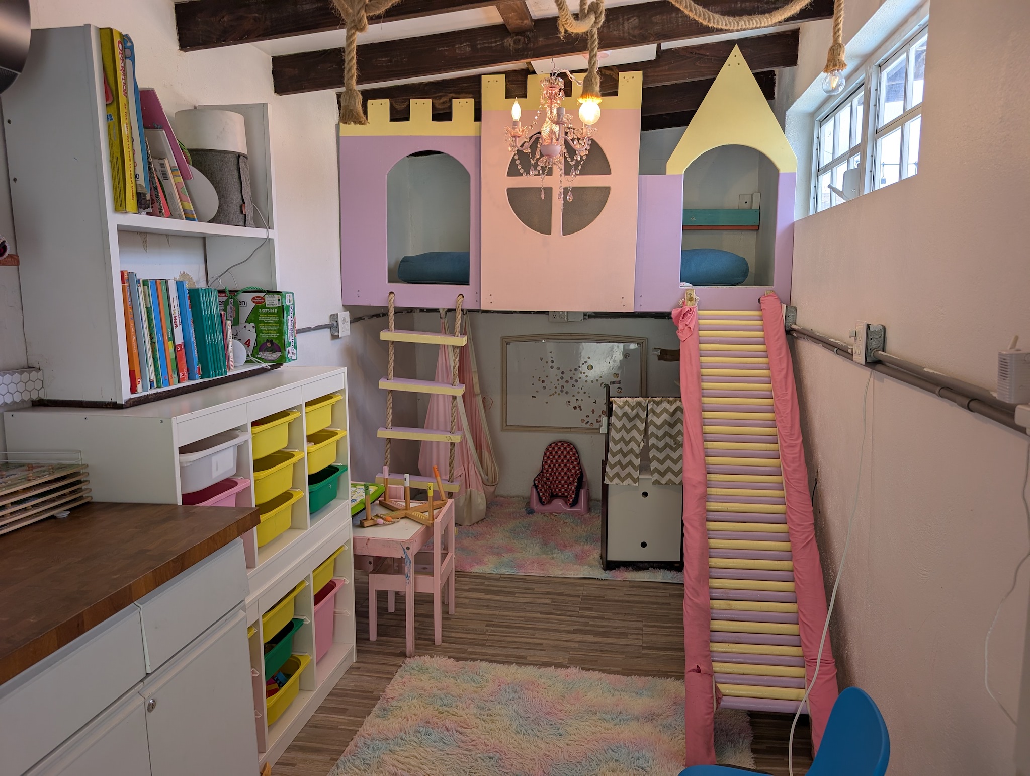 Castle playroom with a loft slide at Villa Coral, downstairs