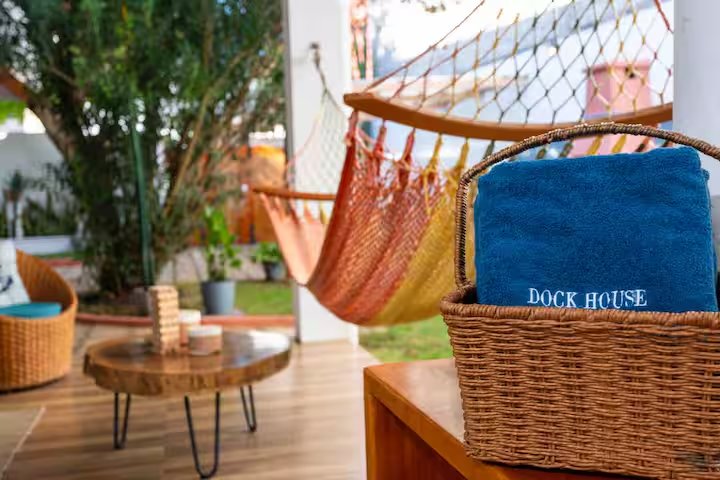 Hammocks at GPS Villa, with Dock House towels in a basket