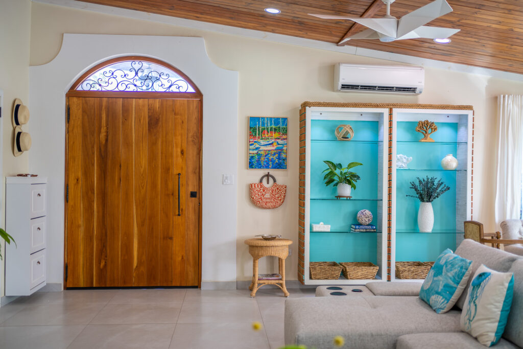 Front teak door and arched window at Villa Coral, Dorado Del Mar