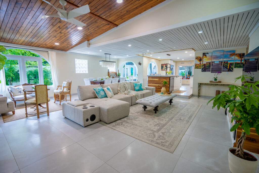 Open living, dining for 12, and kitchen at Villa Coral, Dorado Del Mar
