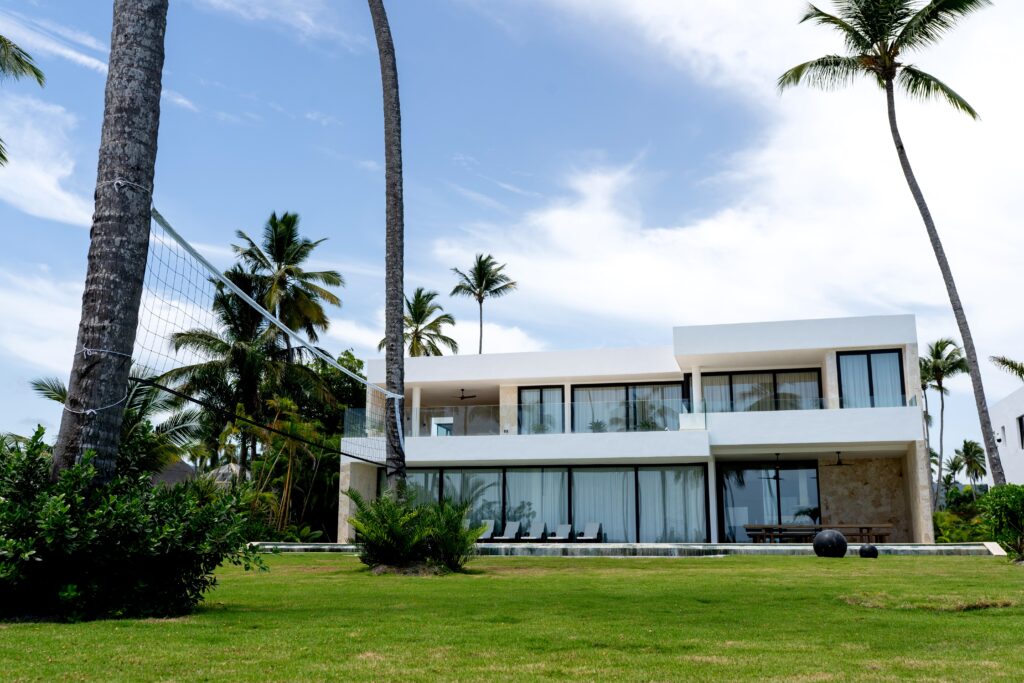 Villa Valentina from the lawn, with the volleyball court in the palms, Cap Bonita, Las Terrenas